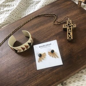 Gold long cross necklace.